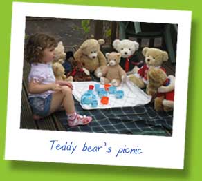 My daughter having a picnic with her teddy bears in the garden