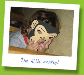 My daughter in a monkey mask!